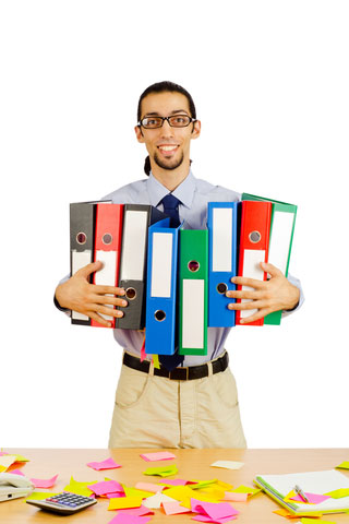 A mentee carrying several binders.